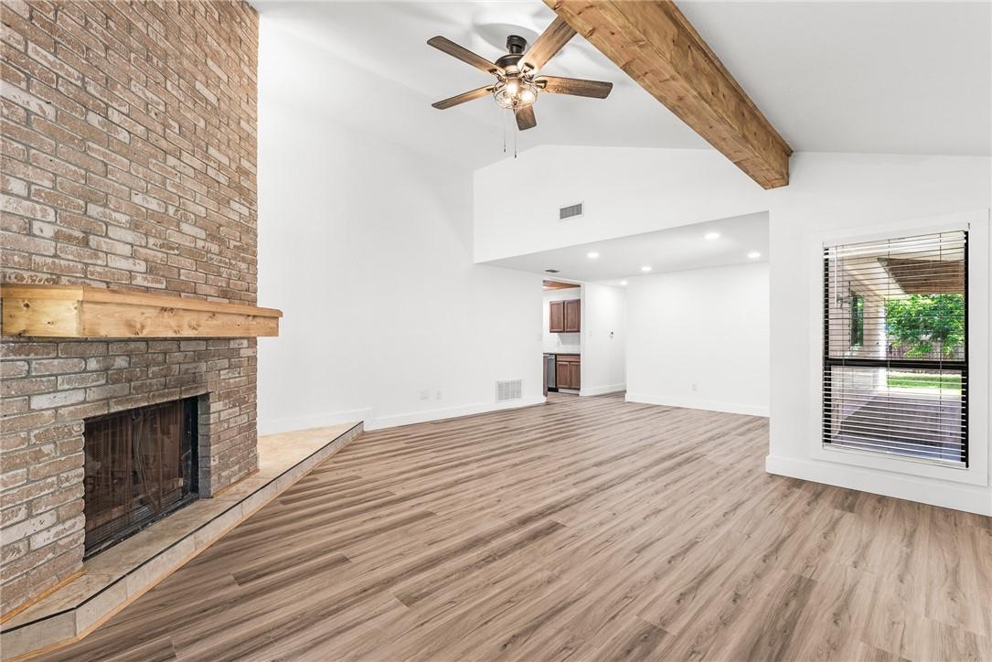 Image 3: Corner fireplace looking towards diining room and