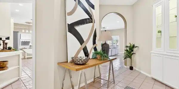 Image 3: Step inside to the inviting foyer with kitchen to