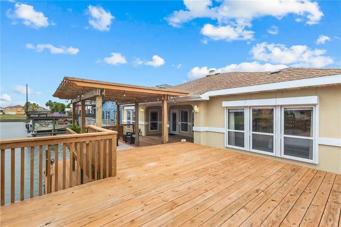 Image 1: Elevated deck, and back of home