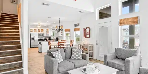Image 3: View of living room, dining area, and kitchen