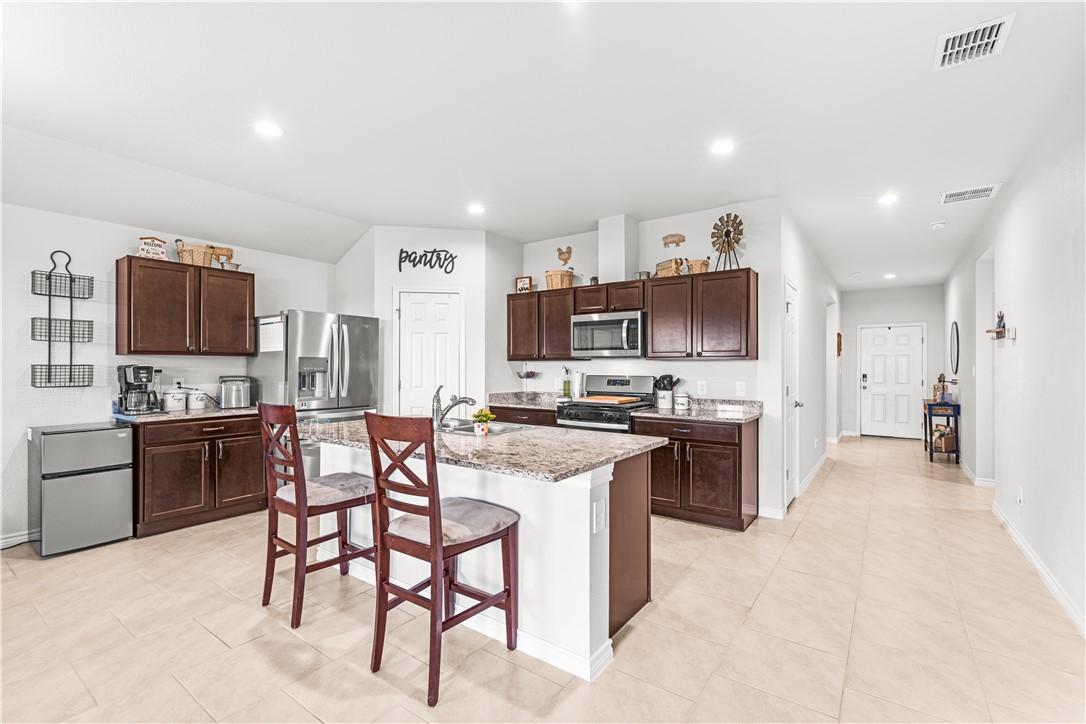 Image 4: Long Entryway, Island With Sink, Recessed Lighting