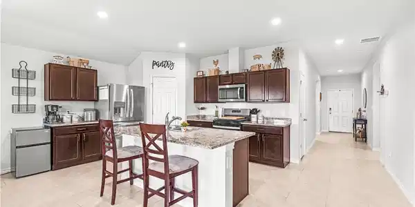 Image 4: Long Entryway, Island With Sink, Recessed Lighting