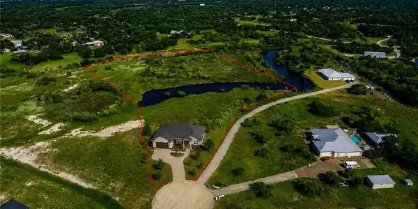 Image 2: AI rendition of a home on the property