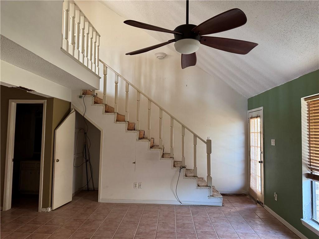 Image 3: Living area to back patio and stairs leading to lo