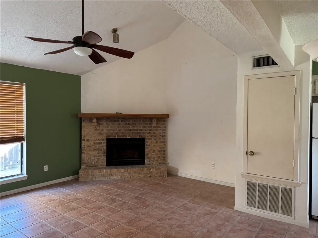 Image 4: Woodburning fireplace.
