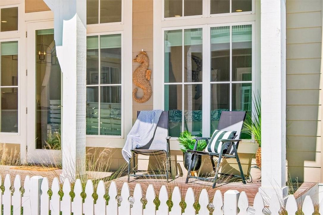 Image 4: Covered front porch offering a private setting to