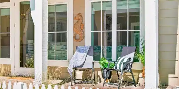 Image 4: Covered front porch offering a private setting to