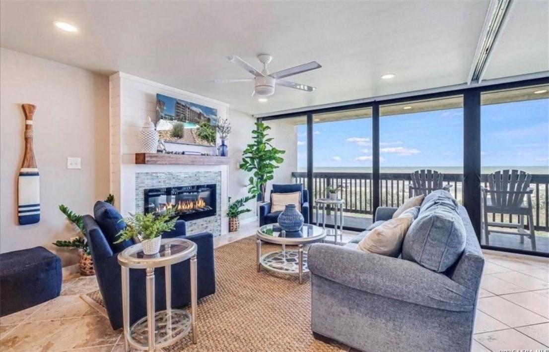 Image 2: Living room with electric fireplace that puts out