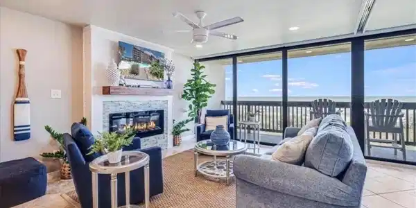 Image 2: Living room with electric fireplace that puts out