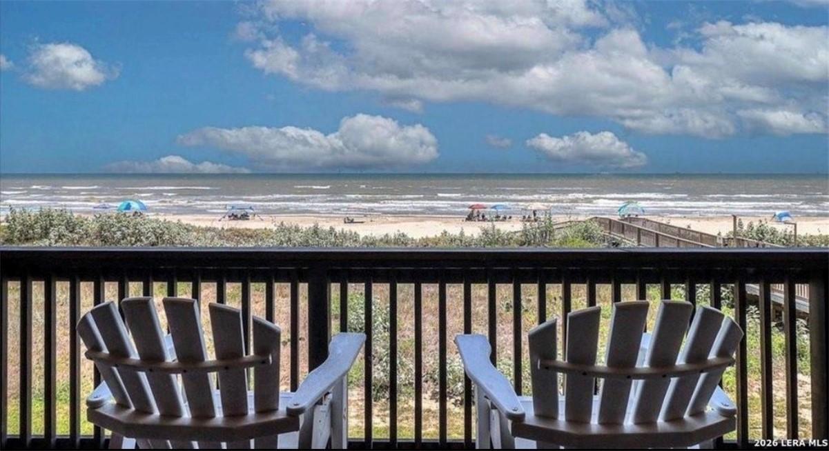 Image 3: private balcony with 6 lounging chairs and table.