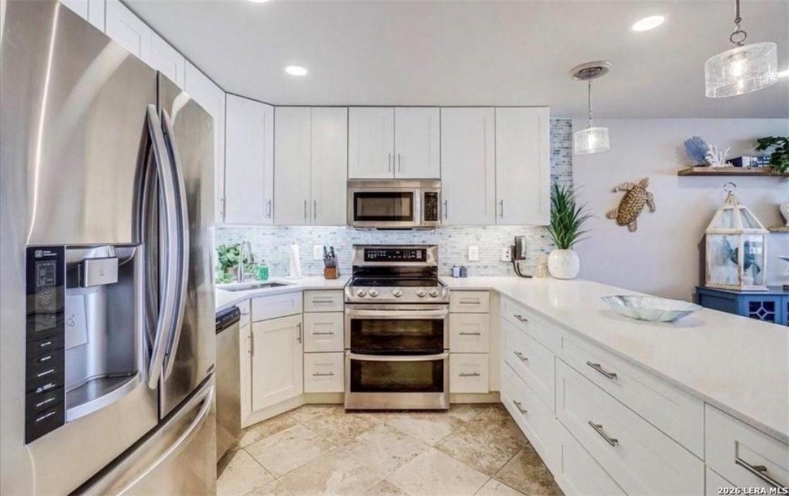 Image 4: Fully stocked kitchen with double oven, microwave,