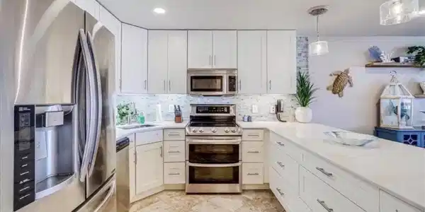 Image 4: Fully stocked kitchen with double oven, microwave,