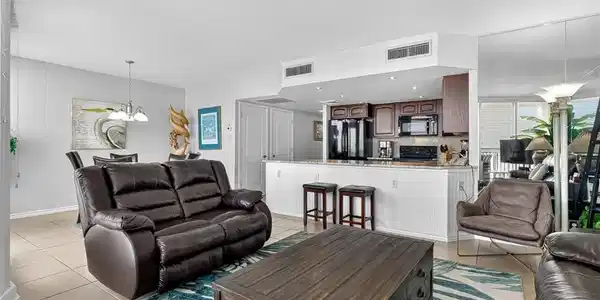 Image 4: Comfy leather couches in living area