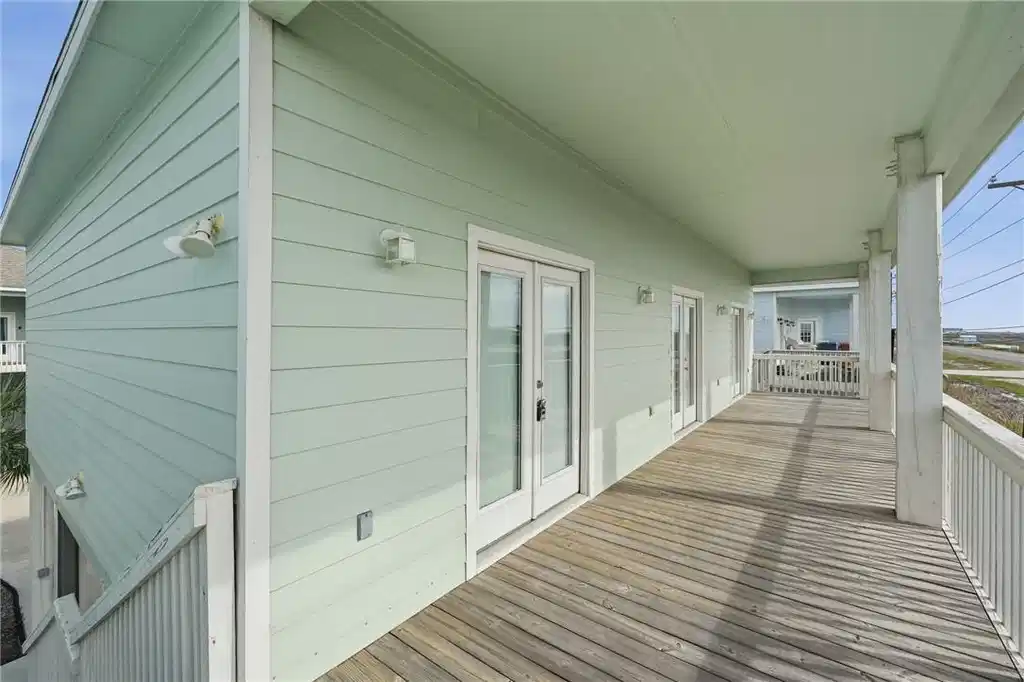 Image 1: Generous covered deck &mdash; ideal for morning coffee,