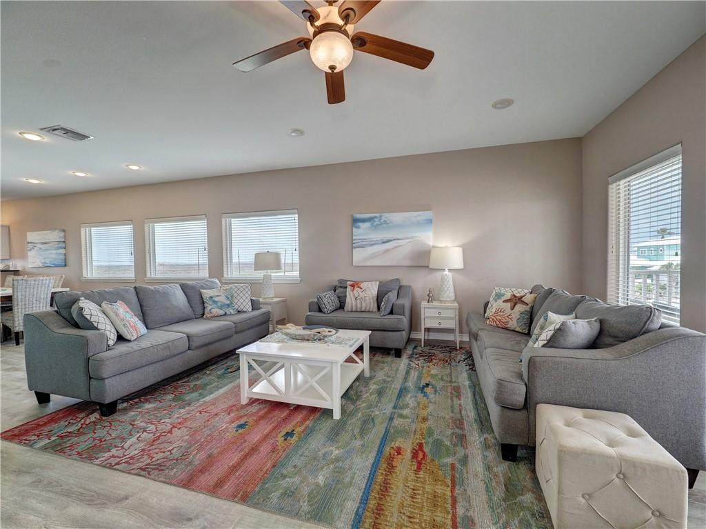 Image 2: Comfortable living space offers plenty of seating.