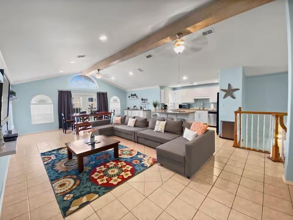 Image 3: Spacious open concept living area with large backy