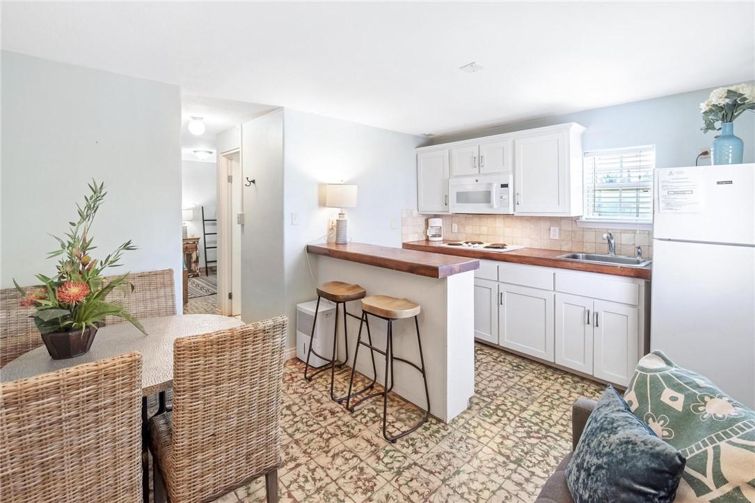 Image 3: Dining Area and Kitchen