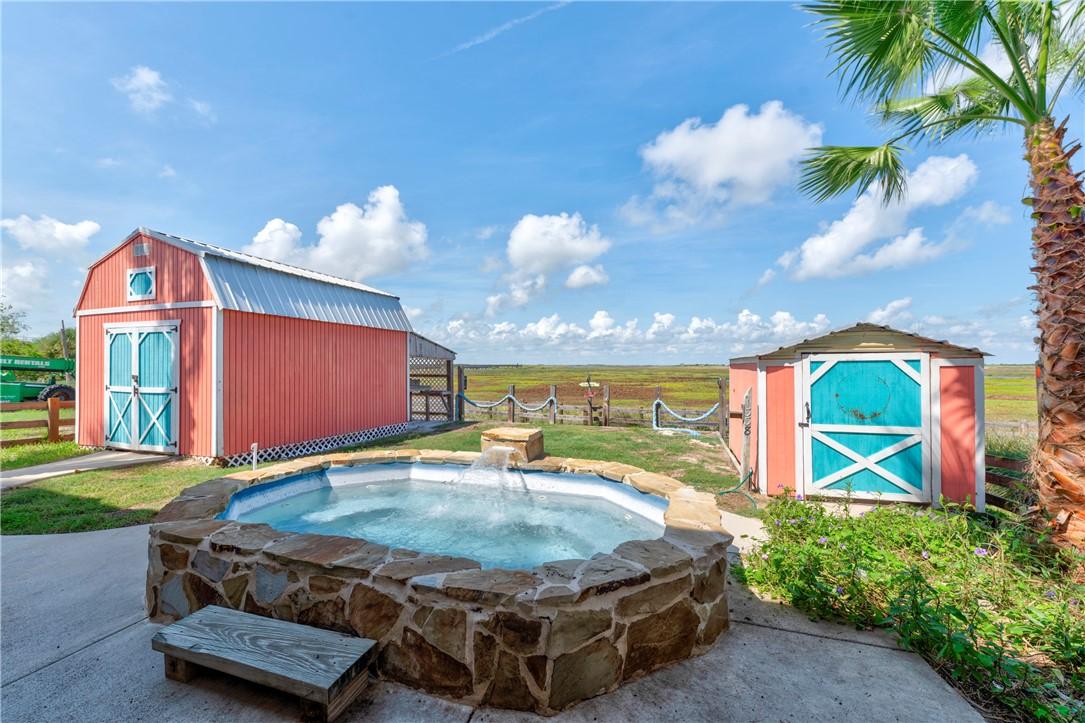 Image 4: Pool and additional storage buildings.