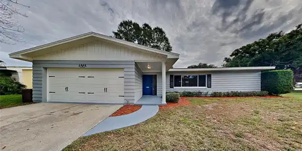 1329 WHISPERING PINES DRIVE