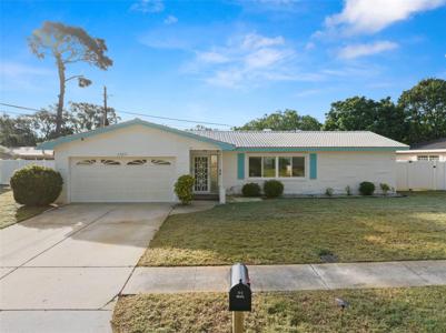 1305 WHISPERING PINES DRIVE